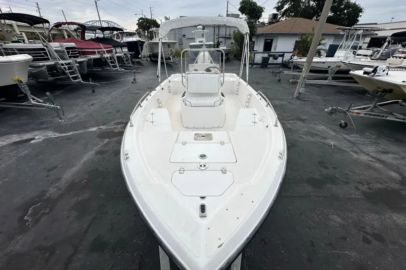 Slide: The Image of 2001 Century 2101 Bay Boat in a marina, surrounded by other boats. - 9