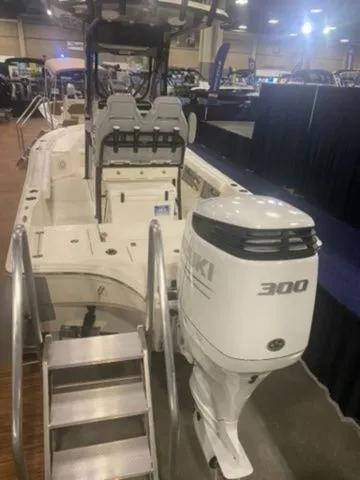 Slide: The Image of 2025 Avenger Boats AV24 with Suzuki 300 outboard motor at a boat show. - 4