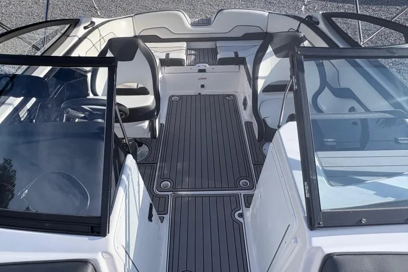 Slide: The Image of 2019 Yamaha Boats SX210 interior with sleek seating and modern design. - 11