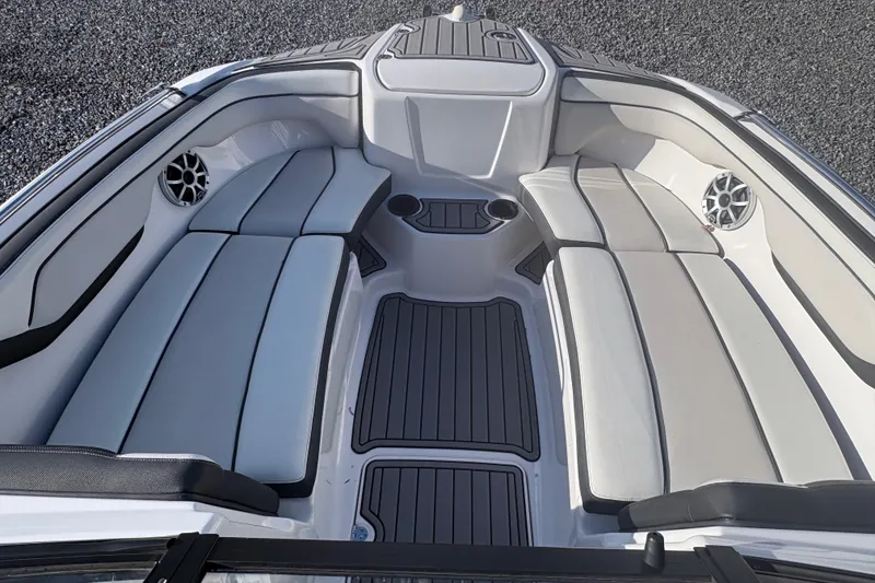 Slide: The Image of 2019 Yamaha Boats SX210 interior with spacious seating and sleek design. - 6