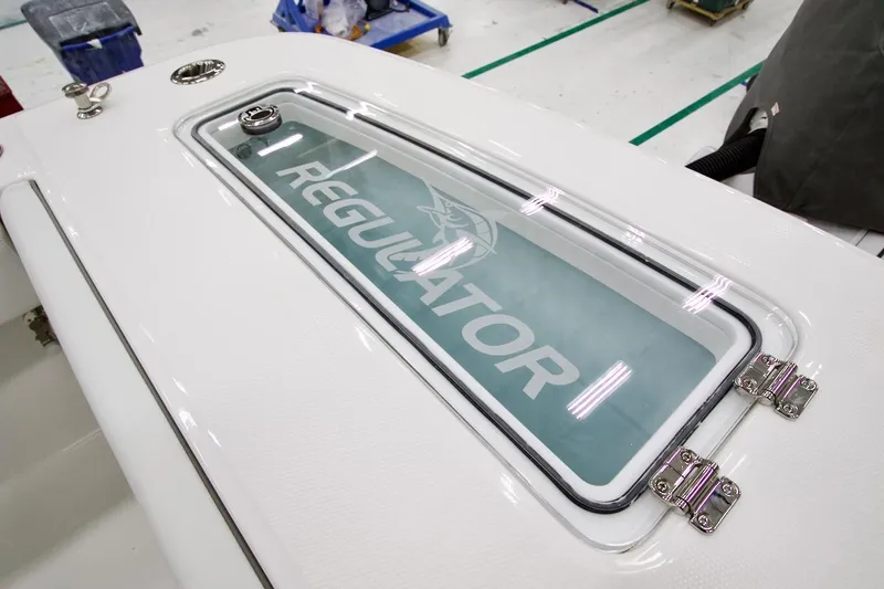 Slide: The Image of 2026 Regulator 31 boat deck with logo and sleek design. - 18