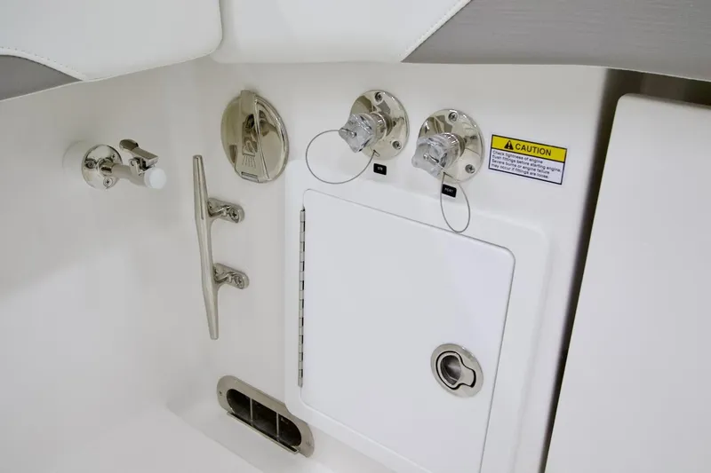 Slide: The Image of 2026 Regulator 31 boat control panel with caution label and fittings. - 22