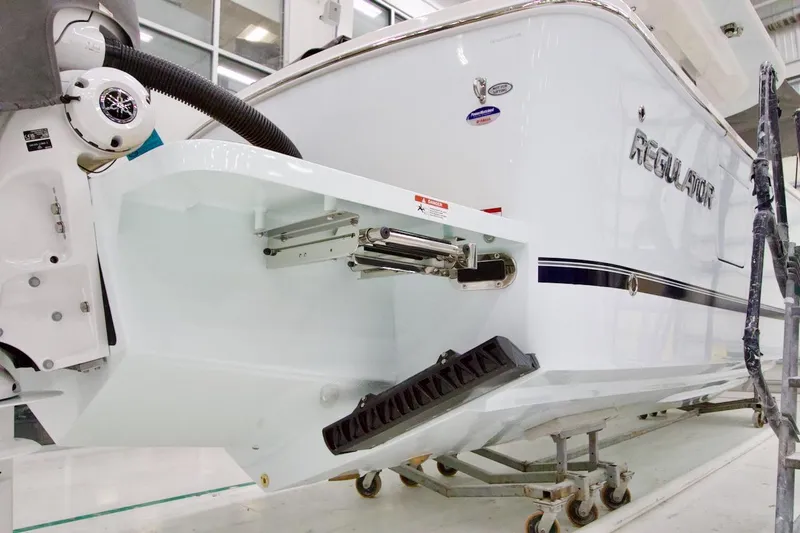 Slide: The Image of 2026 Regulator 31 boat in a workshop, showcasing its sleek design and advanced features. - 45
