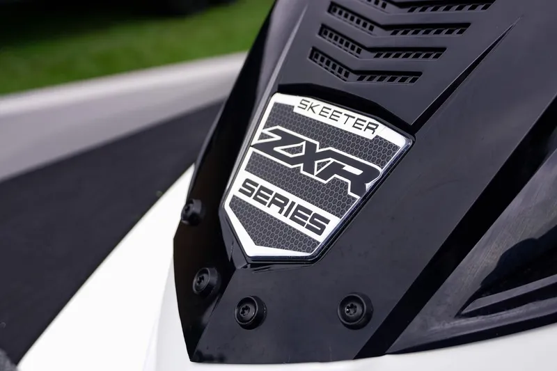 Slide: The Image of 2026 Skeeter ZXR20 SE badge on sleek black surface, showcasing modern design. - 19