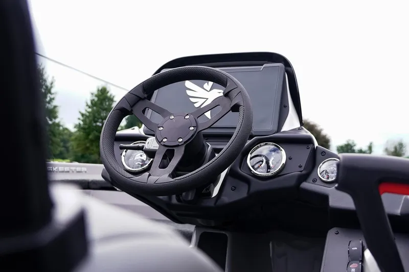 Slide: The Image of 2026 Skeeter ZXR20 SE boat dashboard with steering wheel and gauges. - 21