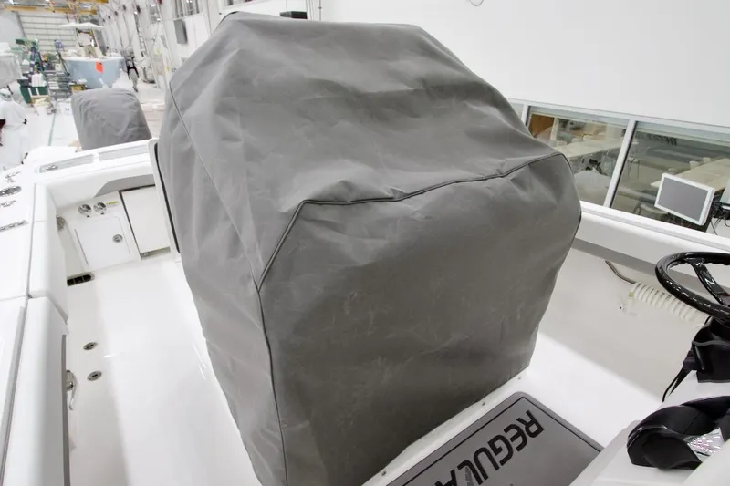 Slide: The Image of 2026 Regulator 31 boat interior with covered console in a manufacturing facility. - 15