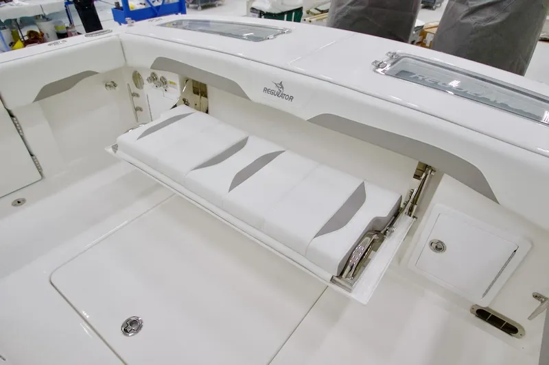 Slide: The Image of 2026 Regulator 31 boat with foldable seating and storage compartment. - 20