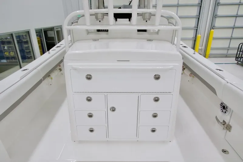 Slide: The Image of 2026 Regulator 31 boat interior with white storage cabinets and sleek design. - 23