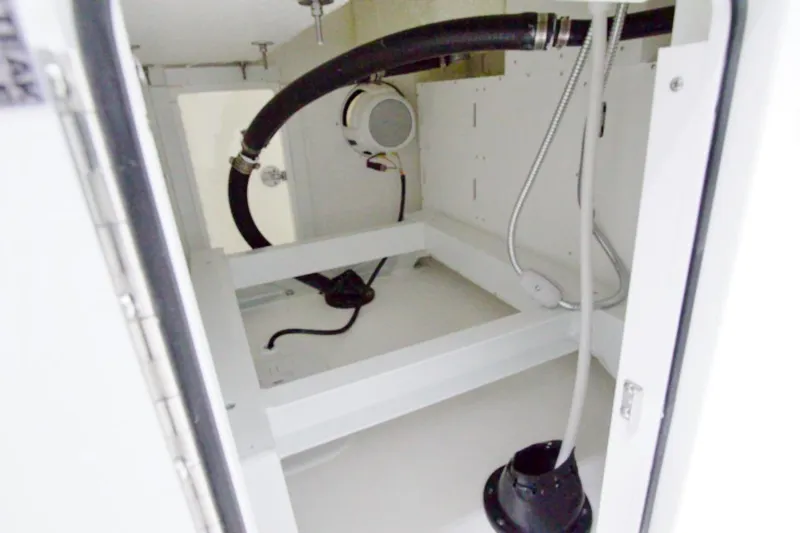 Slide: The Image of 2026 Regulator 31 boat interior compartment with hoses and wiring. - 30