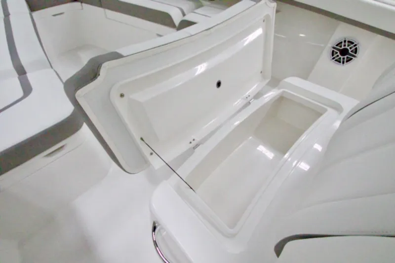 Slide: The Image of 2026 Regulator 31 boat interior with open storage compartment and seating. - 38