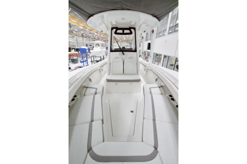 Slide: The Image of 2026 Regulator 31 boat interior, featuring spacious seating and modern design in a factory setting. - 39