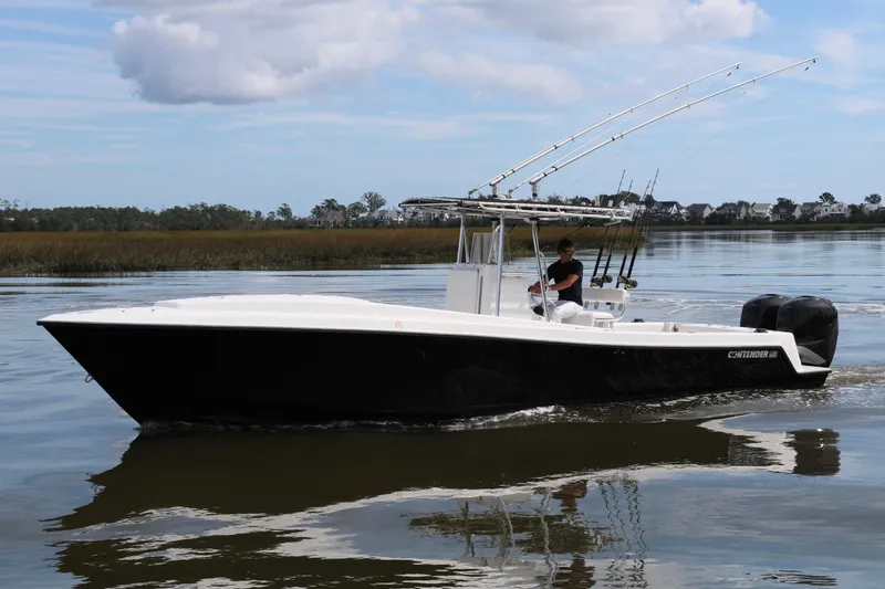 Slide: The Image of 2005 Contender 31 Cuddy boat interior with open hatch, under a bridge. - 12