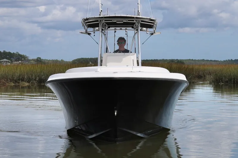 Slide: The Image of 2005 Contender 31 Cuddy boat dashboard with navigation and control instruments. - 5