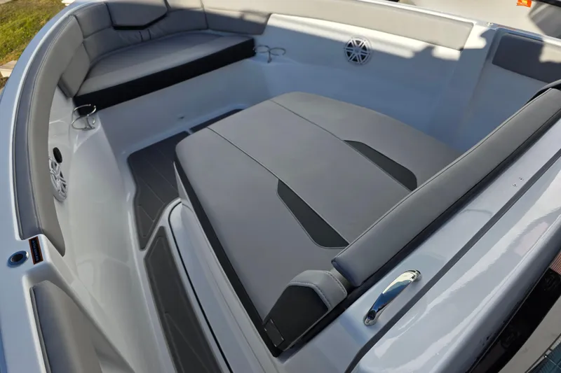 Slide: The Image of 2026 Monterey Elite 25 OB boat interior with gray seating and speaker system. - 16