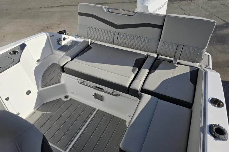 Slide: The Image of 2026 Monterey Elite 25 OB boat interior with gray seating and modern design. - 21