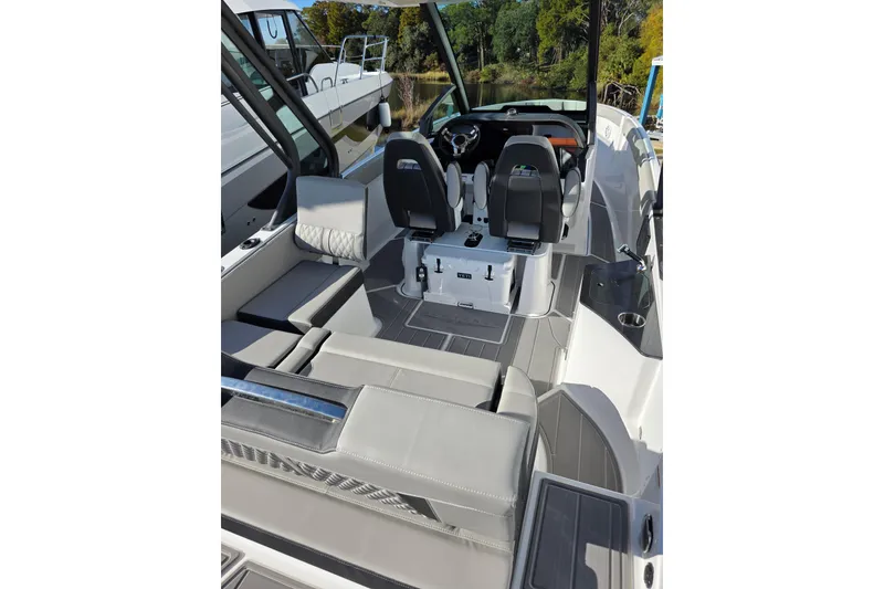 Slide: The Image of 2026 Monterey Elite 25 OB boat interior with sleek seating and modern design. - 6