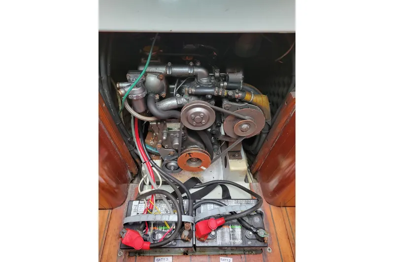 Slide: The Image of Engine compartment of a 1994 Beneteau Oceanis 300 sailboat, showing detailed mechanical components. - 7