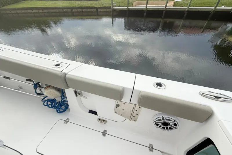 Slide: The Image of 2023 Sportsman Open 322 Center Console boat interior with seating and water view. - 14