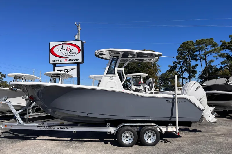The Image of 2026 Tidewater 232 CC Adventure boat on trailer at Marker 17 Marine dealership. - 0