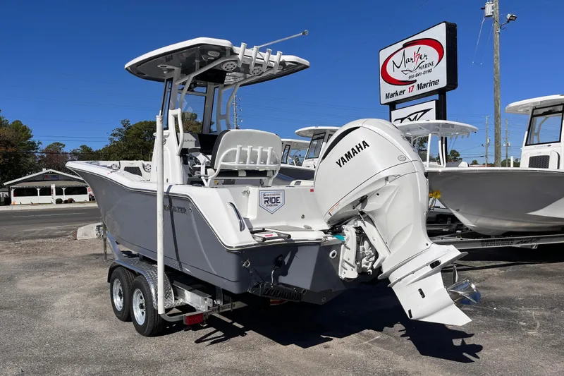 Slide: The Image of 2026 Tidewater 232 CC Adventure boat with Yamaha engine on trailer at Marker 17 Marine. - 2