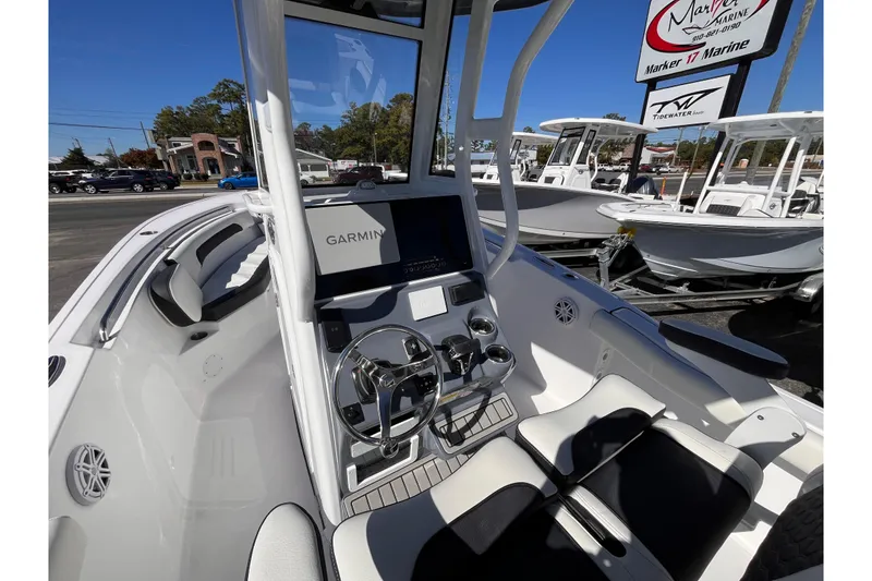 Slide: The Image of 2026 Tidewater 232 CC Adventure boat interior with Garmin navigation system and sleek design. - 7