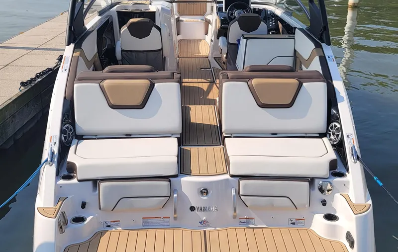 Slide: The Image of 2021 Yamaha Boats 252SD interior with luxurious seating and sleek design. - 21