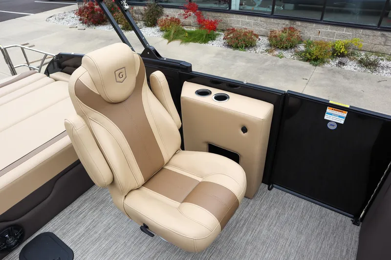 Slide: The Image of Luxurious seating on 2026 Godfrey Monaco 235 SFL boat, featuring beige and brown upholstery. - 12