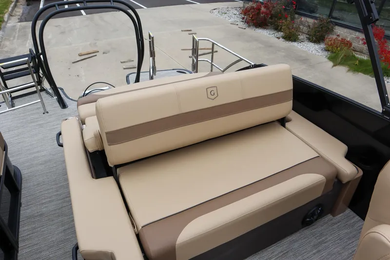 Slide: The Image of 2026 Godfrey Monaco 235 SFL boat interior with beige seating and sleek design. - 13