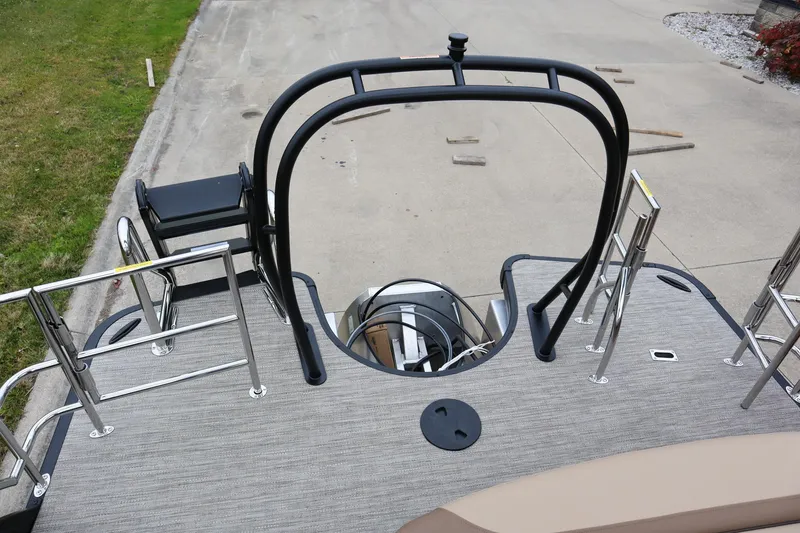 Slide: The Image of 2026 Godfrey Monaco 235 SFL boat deck with sleek railings and ladder. - 16