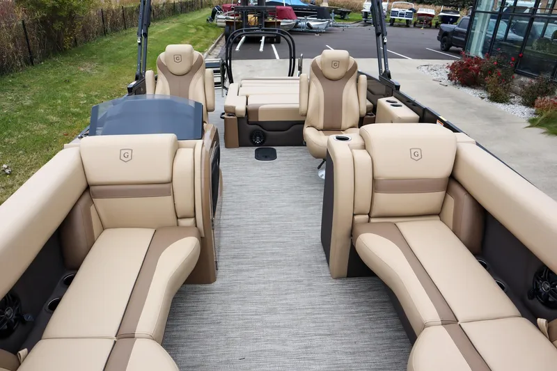Slide: The Image of 2026 Godfrey Monaco 235 SFL pontoon boat with luxurious beige seating and modern design. - 6
