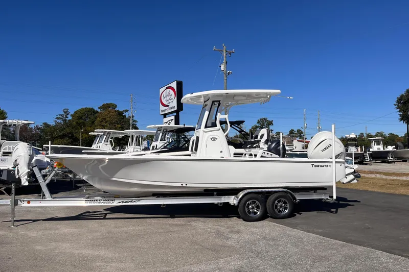 The Image of 2026 Tidewater 2410 Bay Max boat on trailer, displayed outdoors under clear blue sky. - 0