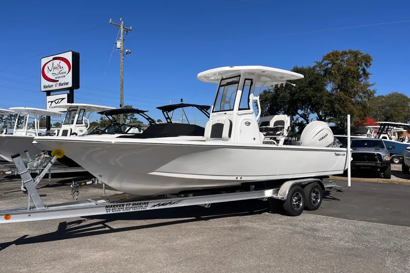 Slide: The Image of 2026 Tidewater 2410 Bay Max boat on trailer at Marker 17 Marine dealership. - 1