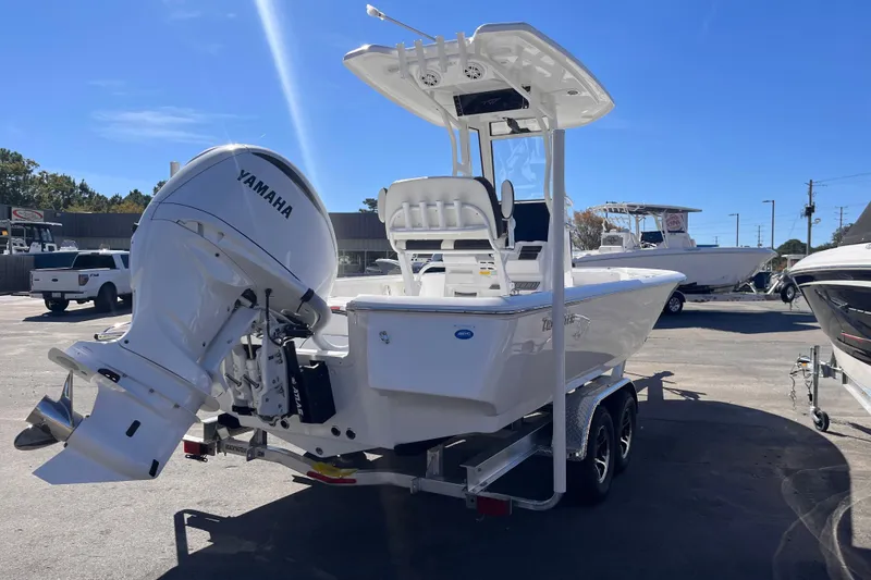 Slide: The Image of 2026 Tidewater 2410 Bay Max boat with Yamaha engine on trailer in sunny dealership lot. - 3