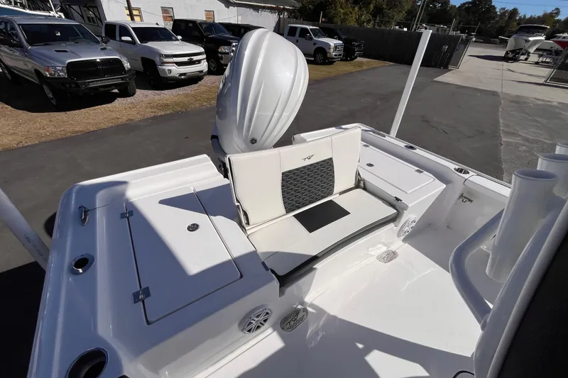 Slide: The Image of 2026 Tidewater 2410 Bay Max boat interior with seating and storage compartments. - 5