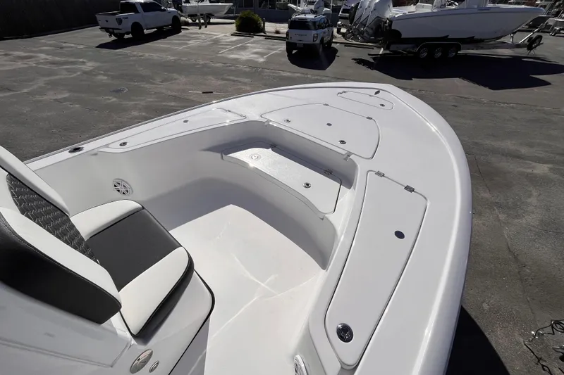 Slide: The Image of 2026 Tidewater 2410 Bay Max boat interior with seating and storage compartments. - 8