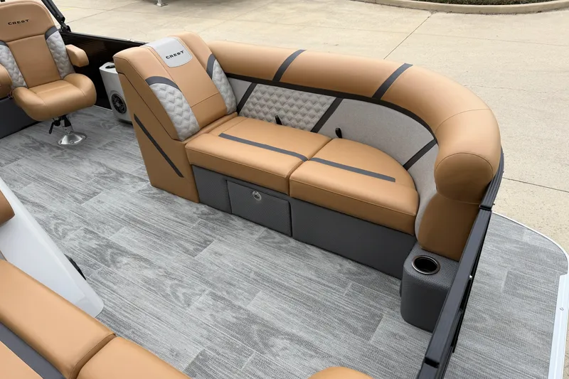 Slide: The Image of Luxurious seating on 2025 Crest Classic 220 pontoon boat with tan and gray upholstery. - 3