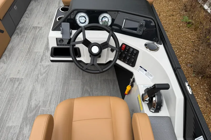 Slide: The Image of 2025 Crest Classic 220 boat dashboard with steering wheel and control panel. - 7