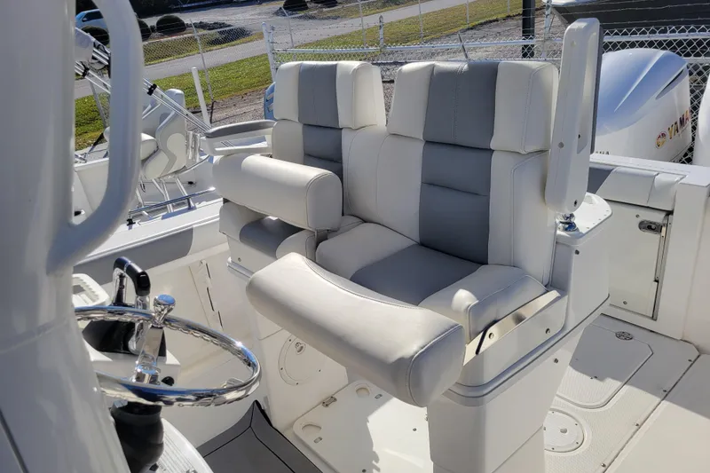 Slide: The Image of 2019 Everglades 255 Center Console boat interior with dual seating and steering wheel. - 3