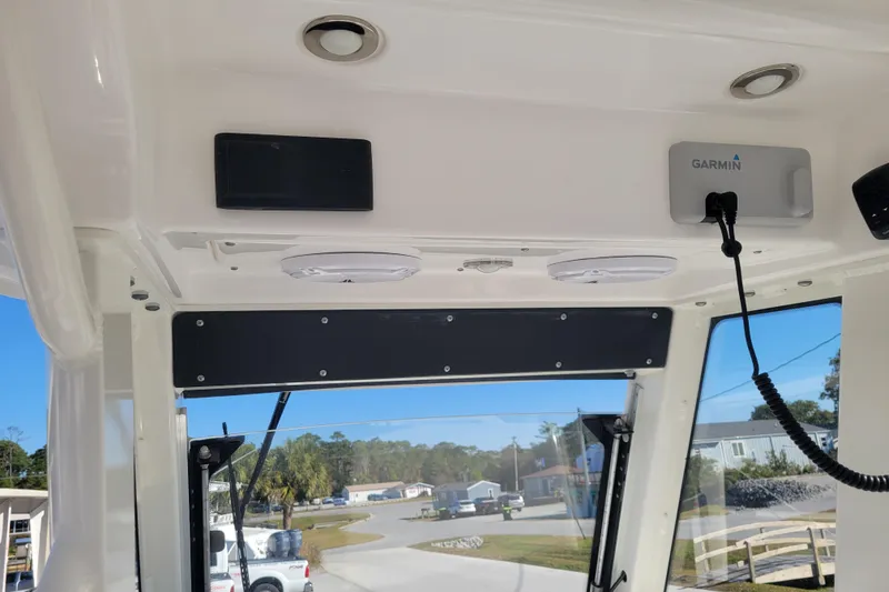 Slide: The Image of 2019 Everglades 255 Center Console boat interior with Garmin equipment and overhead lighting. - 8