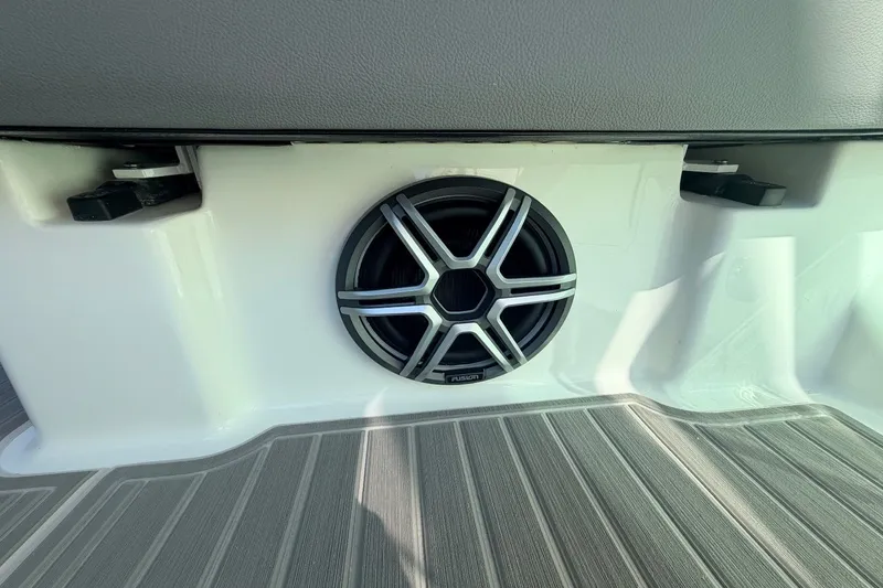 Slide: The Image of A speaker is embedded in the wall of a boat, surrounded by gray flooring. - 47
