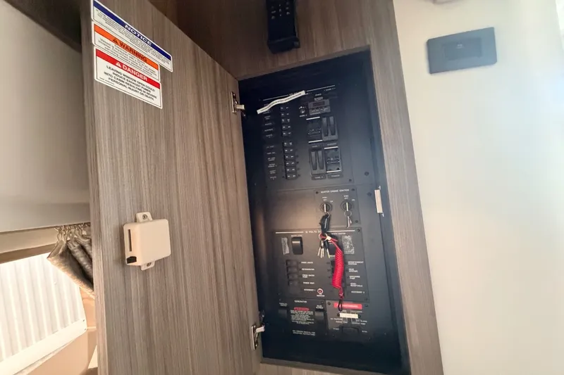 Slide: The Image of Electrical panel in a cabin with wood paneling. - 45