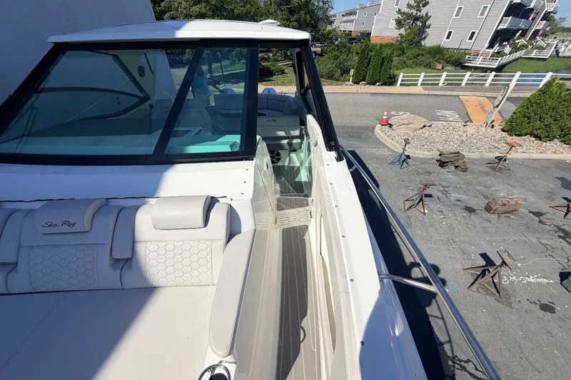 Slide: The Image of 2026 Sea Ray Sundancer 320 Outboard at dock with sleek design. - 42