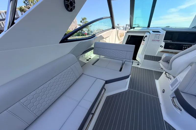 Slide: The Image of Interior of the 2026 Sea Ray Sundancer 320 Outboard with sleek gray seating. - 29