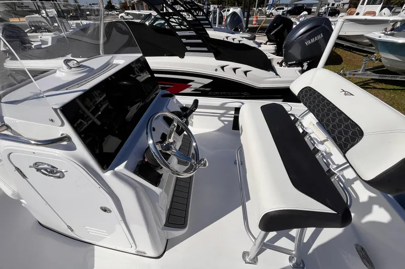 Slide: The Image of 2026 Tidewater 2110 Bay Max boat interior with steering wheel and seating. - 10