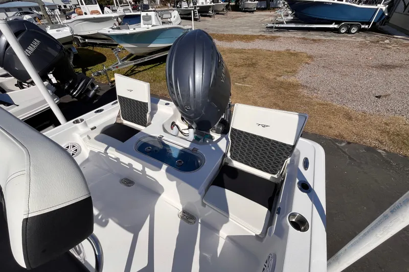 Slide: The Image of 2026 Tidewater 2110 Bay Max boat with Yamaha engine, featuring seating and storage. - 11