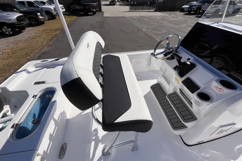 Slide: The Image of 2026 Tidewater 2110 Bay Max boat interior with steering console and seating. - 4