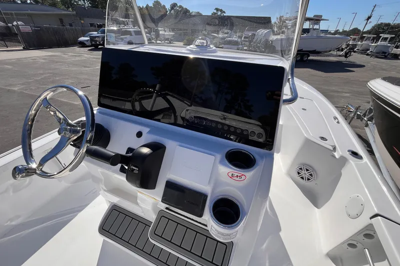 Slide: The Image of 2026 Tidewater 2110 Bay Max boat console with steering wheel and controls. - 5