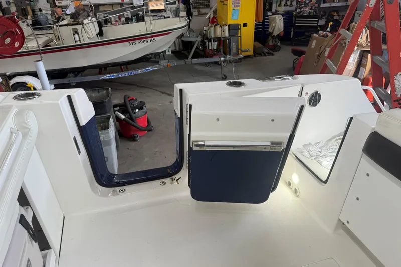 Slide: The Image of 2020 Edgewater 262CX Crossover boat interior in a workshop setting. - 19