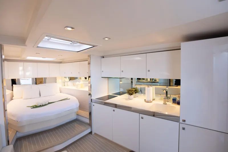 Slide: The Image of Luxurious interior of 2017 VanDutch 55 yacht with modern kitchen and cozy bedroom. - 1