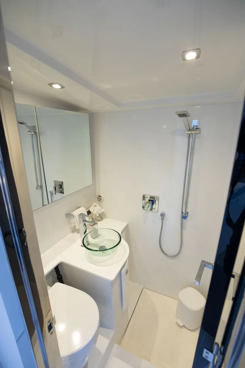 Slide: The Image of Modern bathroom in 2017 VanDutch 55 yacht with sleek fixtures and glass sink. - 8